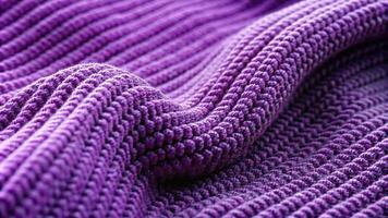 Purple knit fabric with ribbed seam detailing, creating a distinct texture and curved design photo