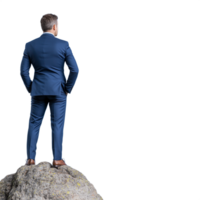 Back view of a man in a business suit standing on a rock looking ahead on a transparent background png