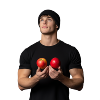 Young man in a black shirt holding two red apples in his hands on a transparent background png