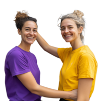 Two smiling women in colorful tshirts hugging each other on a transparent background png
