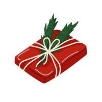 Christmas gift wrapped in red with a string bow and pine leaves decoration in flat style. Design for holiday packaging, seasonal greeting card and festive design. vector