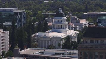 California State Capitol building on a sunny day in Sacramento. The California State Capitol stands as a historic edifice, combining neoclassical architecture with the functions of state government. video