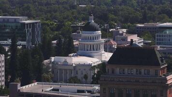 California State Capitol building on a sunny day in Sacramento. The California State Capitol stands as a historic edifice, combining neoclassical architecture with the functions of state government. video