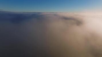 Aerial view White clouds in blue sky. Top view. View from drone. Aerial bird's eye clouds. Aerial top cloudscape. Texture of clouds. View from above at sunset. video
