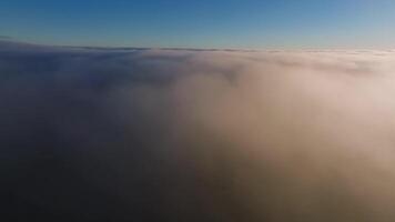 Aerial view White clouds in blue sky. Top view. View from drone. Aerial bird's eye clouds. Aerial top cloudscape. Texture of clouds. View from above at sunset. video