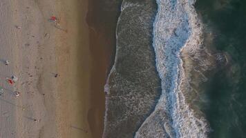 Top view aerial image from drone of an stunning beautiful sea landscape beach with turquoise water with copy space for your text. Top view on coast waves on beach aerial view, crystal clear water. video