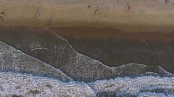 Top view aerial image from drone of an stunning beautiful sea landscape beach with turquoise water with copy space for your text. Top view on coast waves on beach aerial view, crystal clear water. video