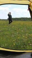 vertical man on hike tries to find a cellular connection, poor connection video
