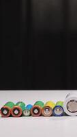 vertical Rotating cylindrical batteries displayed in colorful arrangement video