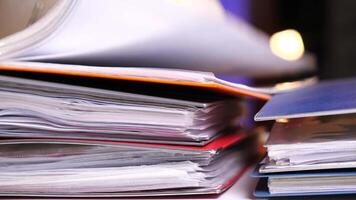 searching for the desired document in a stack of documents, folders video