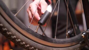 close-up connecting the pump to the wheel valve, inflating bicycle tire, wheels video