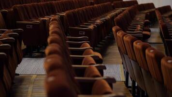 rows of empty bright spectator seats in an empty hall before the show video