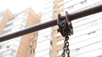 Swing in the playground. Swinging. Close up on chain. video