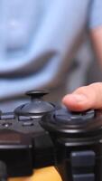 vertical Using controller playing games - close up of joypad video