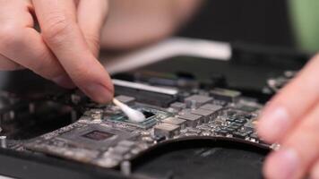 replacing thermal paste on computer processor. Close-up removing thermal paste video