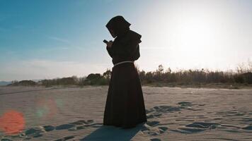 Monk Immersed In The Smartphone Usage video