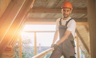 Process of construction new and modern modular house. Worker man in special protective uniform wear working on building development industry of energy efficient property. photo