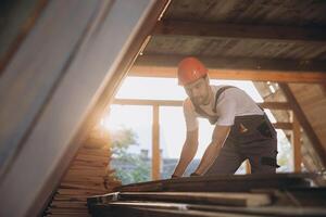 Process of construction new and modern modular house. Worker man in special protective uniform wear working on building development industry of energy efficient property. photo