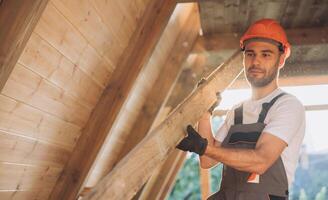 Process of construction new and modern modular house. Worker man in special protective uniform wear working on building development industry of energy efficient property. photo