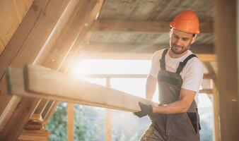 Process of construction new and modern modular house. Worker man in special protective uniform wear working on building development industry of energy efficient property. photo