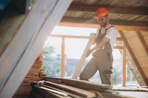 Process of construction new and modern modular house. Worker man in special protective uniform wear working on building development industry of energy efficient property. photo