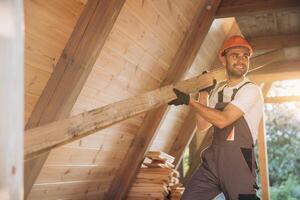 Process of construction new and modern modular house. Worker man in special protective uniform wear working on building development industry of energy efficient property. photo