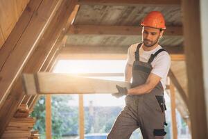 Process of construction new and modern modular house. Worker man in special protective uniform wear working on building development industry of energy efficient property. photo