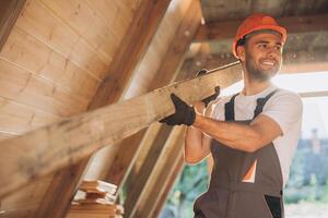 Process of construction new and modern modular house. Worker man in special protective uniform wear working on building development industry of energy efficient property. photo