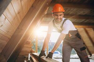 Process of construction new and modern modular house. Worker man in special protective uniform wear working on building development industry of energy efficient property. photo
