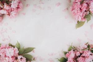 Sprigs of the sakura tree with flowers and petals on trendy marble background. Place for text. The concept of spring came. Top view. Flat lay photo