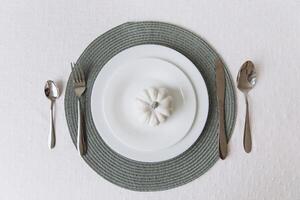 Thanksgiving set. Table setting, white plates with pumpkin, mockup photo