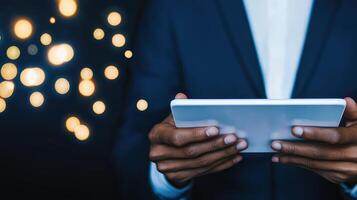 A businessman utilizes a tablet to enhance virtual operations, ensuring seamless management and problemsolving for quality control. photo