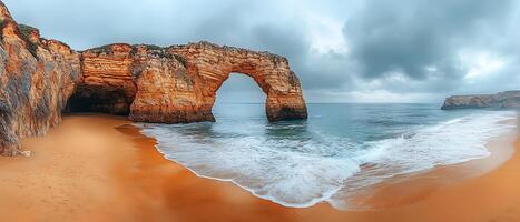 Scenic coastal view with an arch and gentle waves on the beach. photo