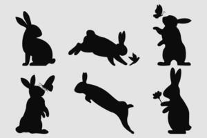 Rabbit Silhouettes in Various Poses with Nature Elements vector