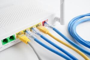 Ethernet cable with wireless router connect to internet service provider network. photo