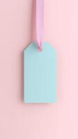 Rectangular blue blank paper tag label price tag with hanging satin rope isolated pink photo
