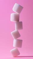 A stack of crystal sugar cube balancing standing concept solid background photo
