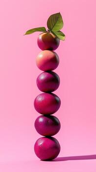 A stack of mangosteen slice fruit balancing on top with solid background photo
