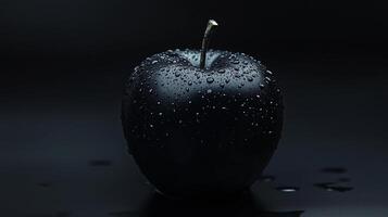 Black apple closeup focused with surface and water drop dark photo effect
