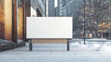 Mockup white blank board copy space for information on winter in park with chair photo