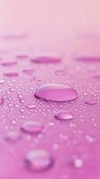 Waterdrop bubble splashing rounded on pink blurred background photo