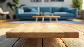 Wooden tabletop in modern living room with blue sofa and decor photo