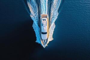 Luxurious yacht cruising through calm waters at sunset photo