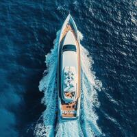 Luxurious yacht cruising through deep blue waters under clear skies photo