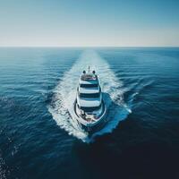 Luxurious yacht gliding through calm waters on a sunny day photo
