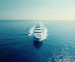 Luxurious yacht navigating through calm blue waters on a sunny day photo