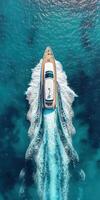 Luxurious yacht cruising through clear turquoise waters at midday photo