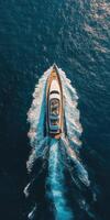 Luxurious yacht cruising through clear waters on a sunny day photo