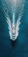 Luxurious yacht cruising through crystal clear waters on a sunny day photo