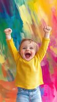 Excited toddler cheering in colorful background on a sunny day photo